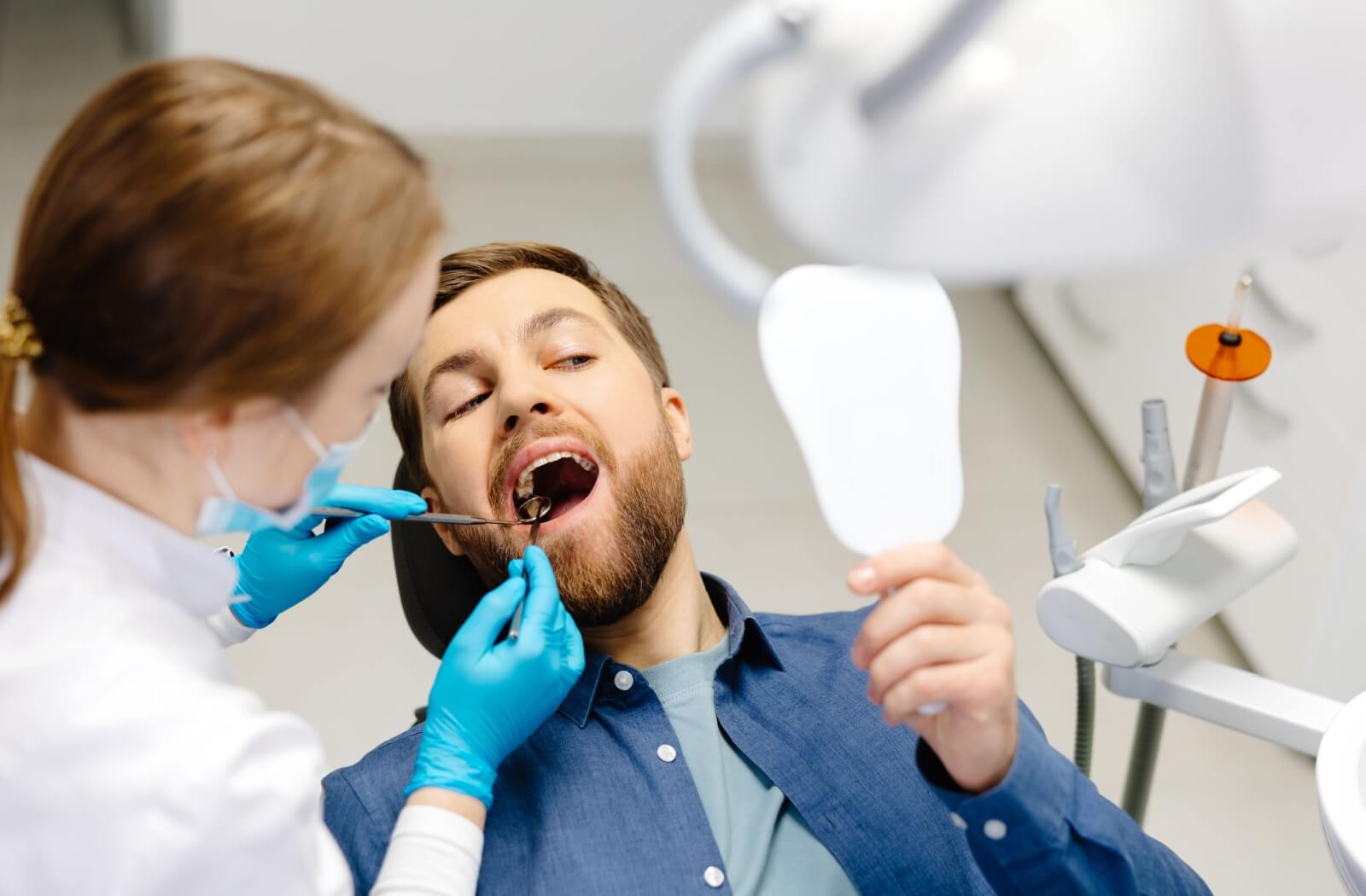 A person at a dental office, having a routine dental cleaning to help prevent gum disease and maintain oral health.